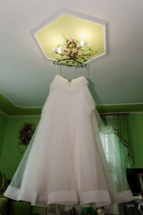 Wedding dress on a hanger. morning of the bride