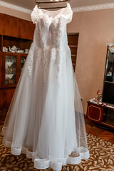 Wedding dress on a hanger. morning of the bride