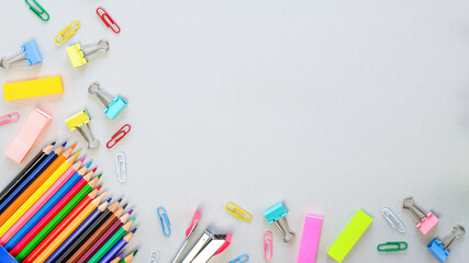 School supplies on gray background. Education concept. Top view, copy space