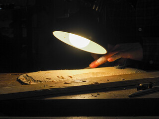 Closeup of a violin luthier at work