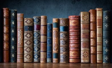 Old antiques books on wooden shelf. Tiled Bookshelf background.  Concept on the theme of history, nostalgia, old age. Retro style. The book is a symbol of knowledge. - 490148248