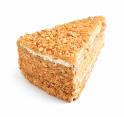 Slice of delicious honey cake isolated on white