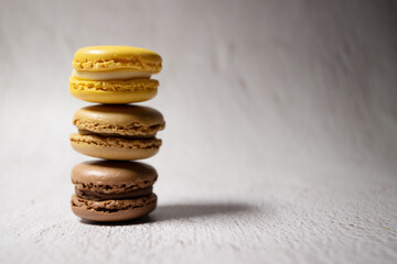 macaroons stacked color with copy space on a neutral background