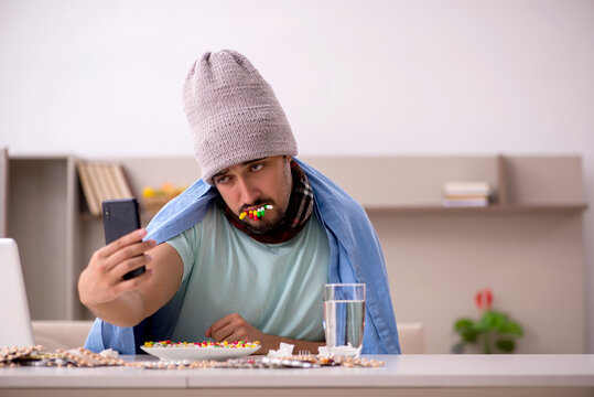 Young Sick Man Suffering At Home