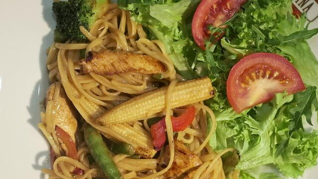 Delicious Food. Plate With Spaghetti And Salad. On Plate Tomatoes Arugula Corn.