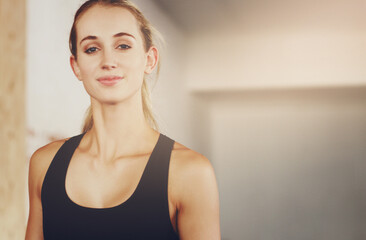 The gym is like my second home. Cropped portrait of an attractive young woman working out in the gym.