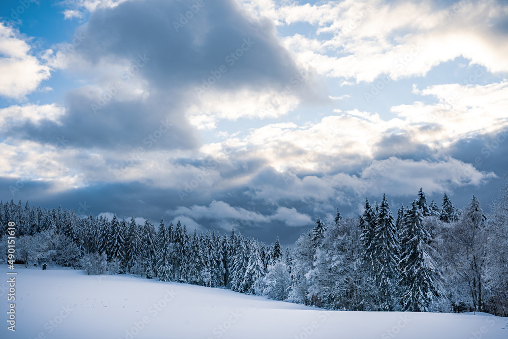 Sticker Cloudscape over the scenic Bavarian forest in winter, Germany