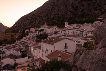 Fototapeta premium Panoramic view of the beautiful andalusian white town of Villaluenga del Rosario in Grazalema mountain range at sunset, Cadiz, Andalusia, Spain