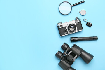 Fototapeta na wymiar Set of travel items with photo camera on color background