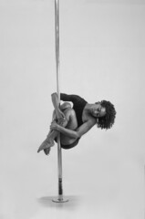 pole dance black girl in bikini posing, black and white photo