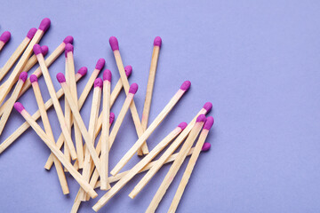New matchsticks on purple background