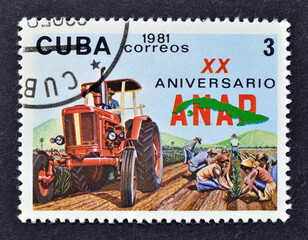 Cancelled postage stamp printed by Cuba, that shows Tractor, 20th Anniversary of ANAP, circa 1981.