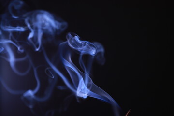 SMOKE IN LIGHT. SMOG ON BLACK BACKGROUND - 490160207