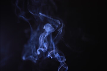 SMOKE IN LIGHT. SMOG ON BLACK BACKGROUND - 490160208