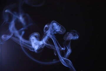 SMOKE IN LIGHT. SMOG ON BLACK BACKGROUND - 490160209