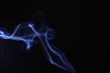 SMOKE IN LIGHT. SMOG ON BLACK BACKGROUND - 490160216
