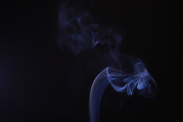 SMOKE IN LIGHT. SMOG ON BLACK BACKGROUND - 490160220