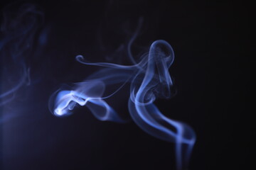SMOKE IN LIGHT. SMOG ON BLACK BACKGROUND - 490160221