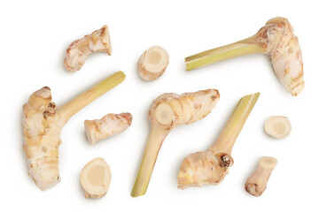 Fresh galangal root with slices isolated on white background with clipping path and full depth of field. Top view. Flat lay