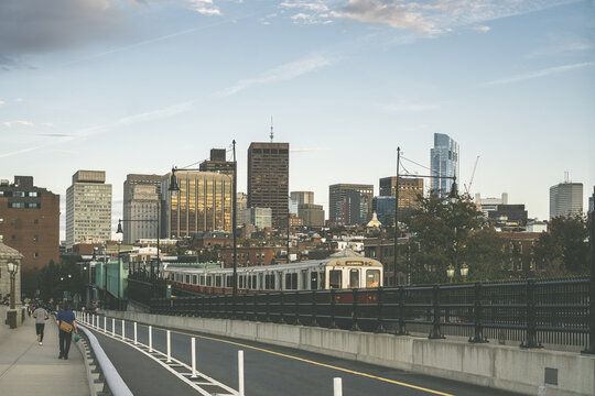 Boston Red Subway Line On The Longfellow Bridge With Scenic View Of Skyscrapers