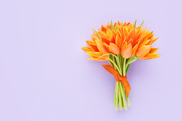 Orange tulips bouquet on a lilac background. Mothers Day, Valentines Day, birthday concept