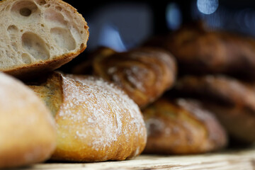 freshly baked bread loaves on a wooden shelf