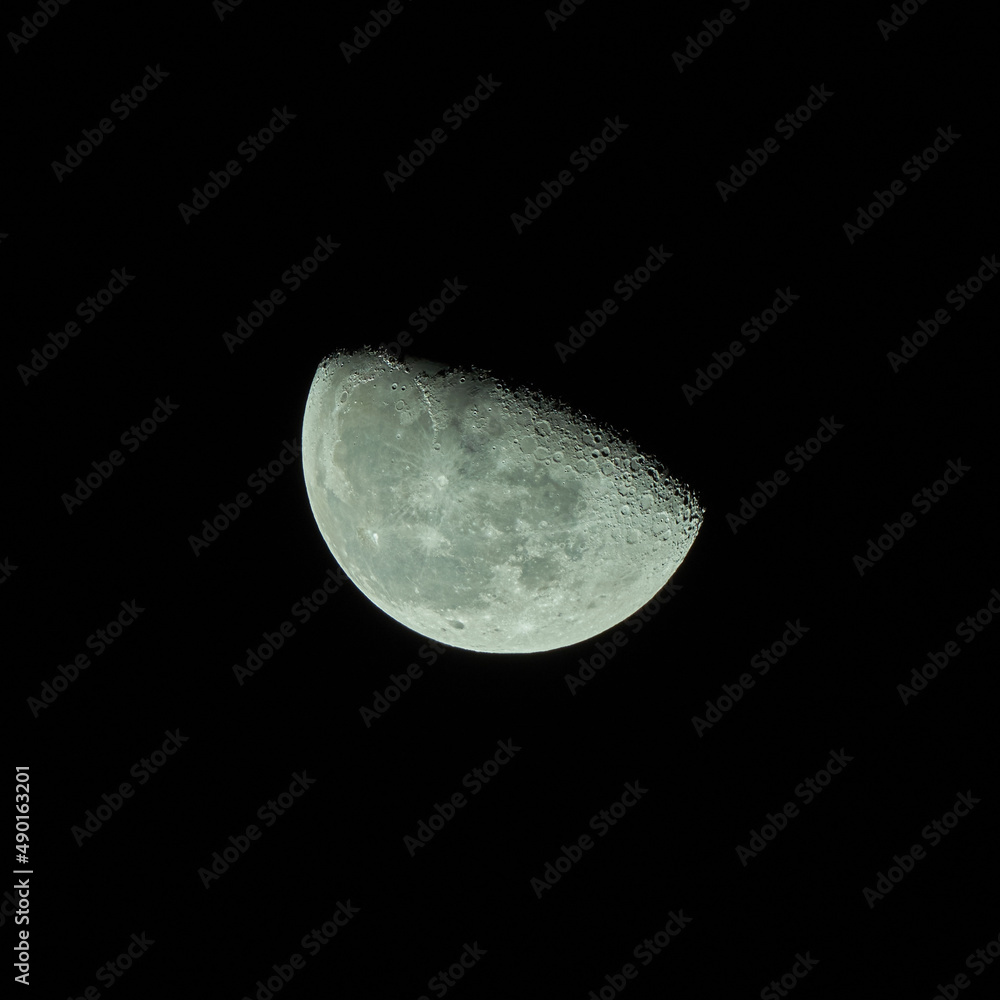 Poster Scenic view of a half-moon illuminating the dark sky