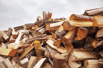 A pile of split firewood for heating a house.