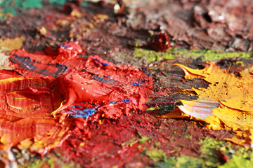 Multicolored brushstrokes of oil. Drops of oil on the canvas. Oil smears are taken up close. Colored texture. Paint stains. Abstract background. Modern Art