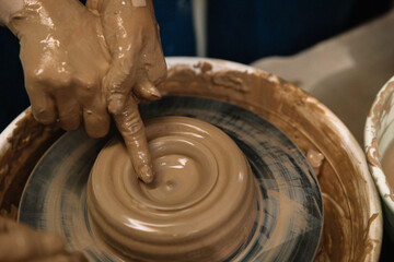 Fototapeta premium hands of a potter at work