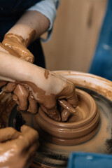hands of a potter at work