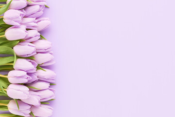 Bouquet of lilac tulips on a lilac background. Mothers Day, Valentines Day, birthday concept