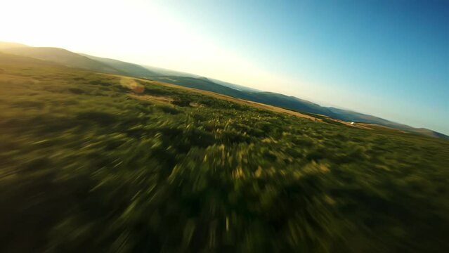 Fpv Drone footage of Llangynidr mountain flying low across the ground and viewing the welsh valleys in the distance. wales uk