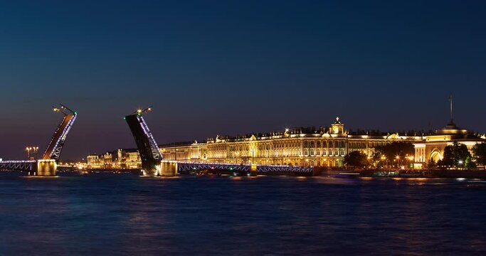 Time lapse of opening Palace Bridge in dusk, Winter Palace on a background, a lot of observing tourists, Neva River at sunrise, the Admiralty building, a lot ships and boats