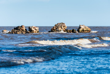 Cape Kolka with stones in water and Baltic sea, Kolka, Latvia.