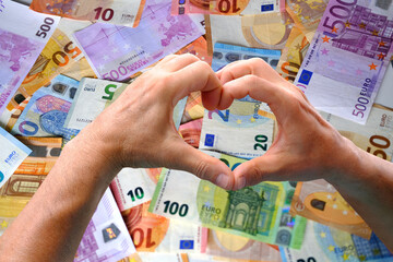 closeup male hands hold american money, count dollars against background of paper euro banknotes,...