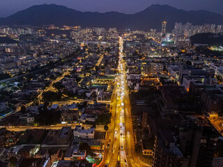 Beautiful drone shot of a Waterloo Road in the nighttime in Hong Kong.