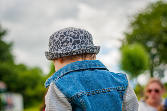 Boy In Grey Leopard Hat And Jeans Jacket