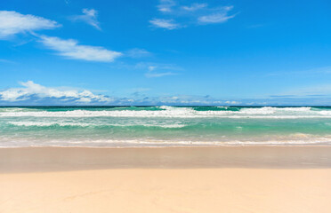 Empty tropical sandy beach with turquoise ocean