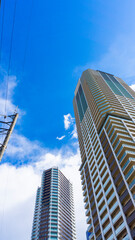 Exterior of high-rise condominium and refreshing blue sky scenery_w_39