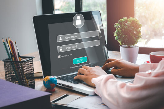 Person hand typing on keyboard with login and password on screen display, cyber security concept, data protection and secured internet access.