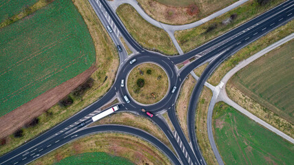 Aerial shot of a roundabout surrounded by farm fields in Elsenfeld, Bavaria, Germany