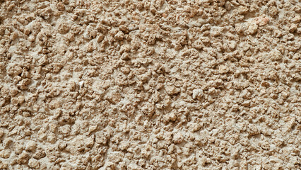 Decorative plaster. Wall stucco texture beige color.