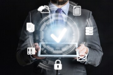 Businessman holding digital tablet with virtual document and mark correct sign