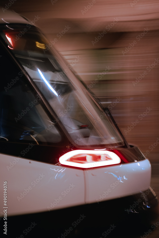 Poster Closeup shot of a high-speed train front part in motion, Strasbourg at night, France