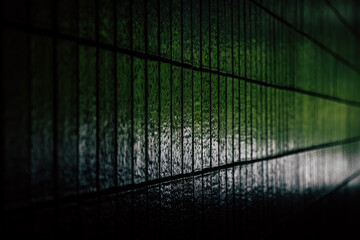 Closeup of a green tile wall in tunnel