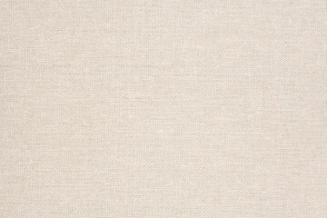 Horizontal beige canvas texture, closeup background.