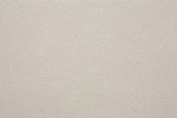 Horizontal beige leather texture close up background.