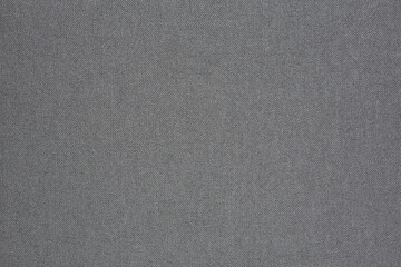 Fototapeta na wymiar Horizontal flat lay close up of textured black fabric book cover.
