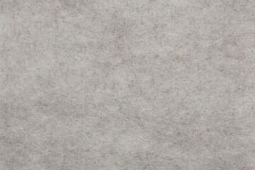 Horizontal beige felt material texture background. Close up.